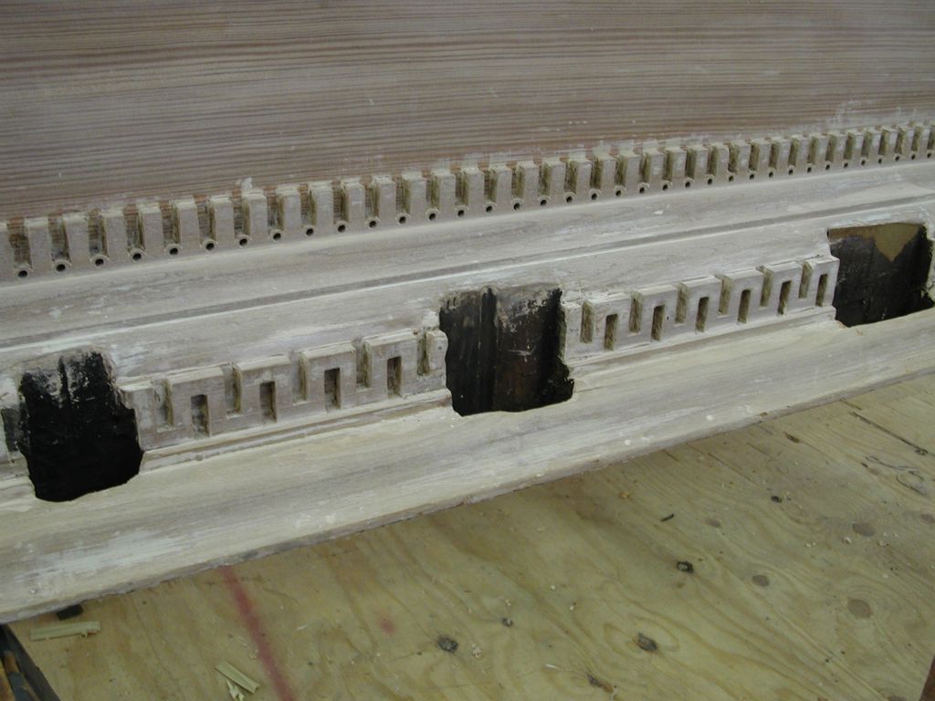 Holes in cornice for bellows pumping levers